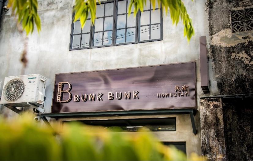 a building with a sign that reads bump bump at Rumah Tetamu Bunk Bunk in Melaka