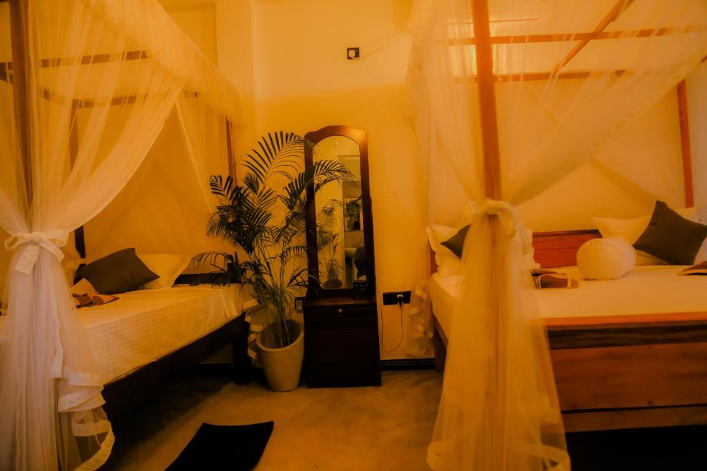 Postel nebo postele na pokoji v ubytování Ruwan Jungle Homestay