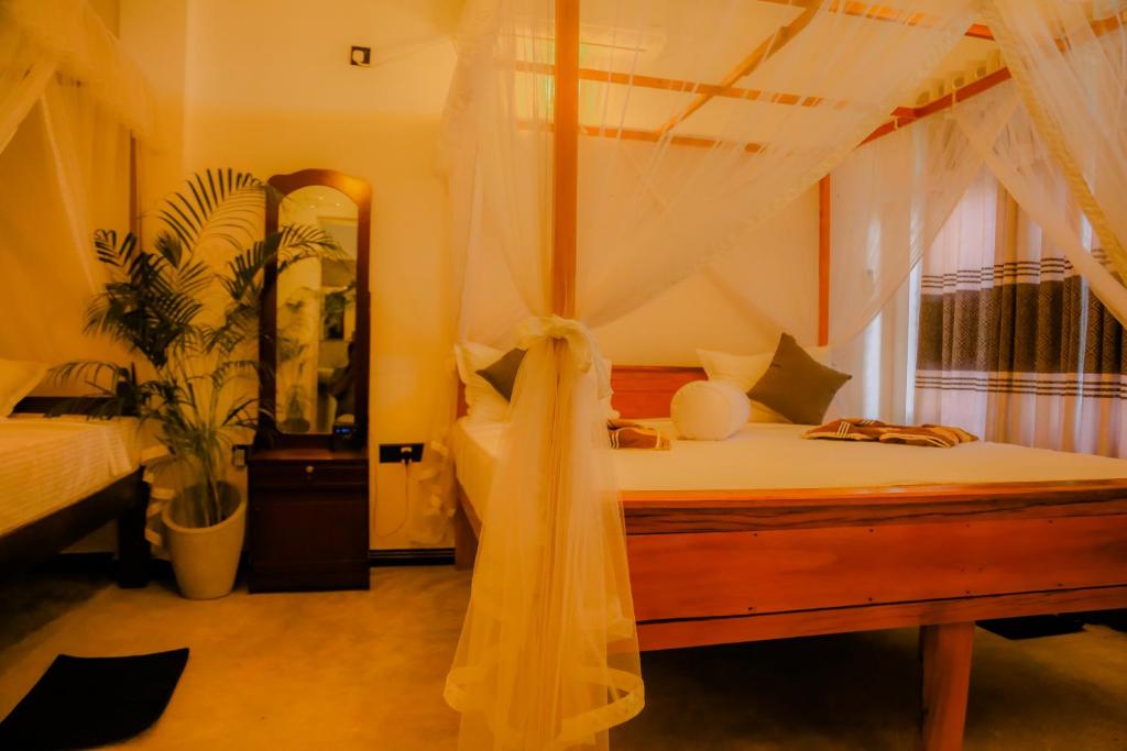 Postel nebo postele na pokoji v ubytování Ruwan Jungle Homestay