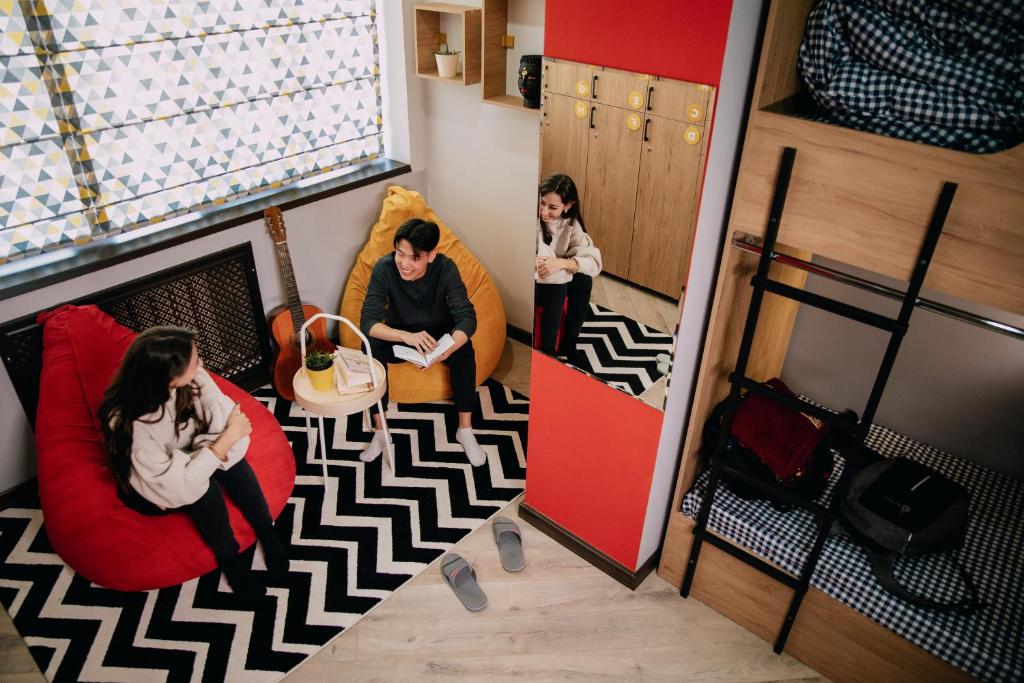 a group of people sitting in a room at People Hostel in Bishkek