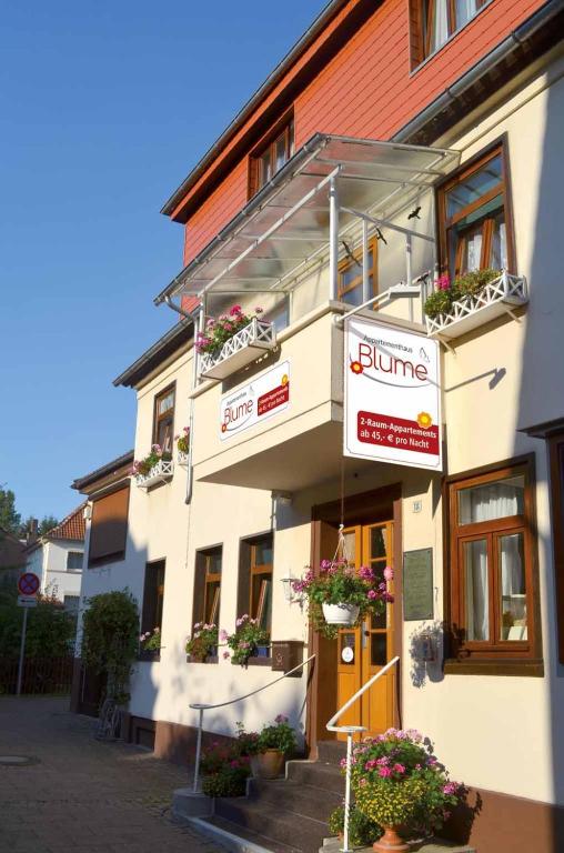 a building with signs on the front of it at Appartementhaus Blume in Bad Pyrmont