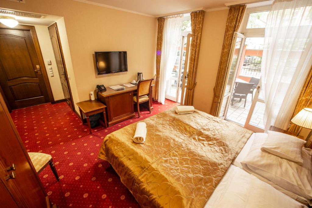Postel nebo postele na pokoji v ubytování Mozart Hotel