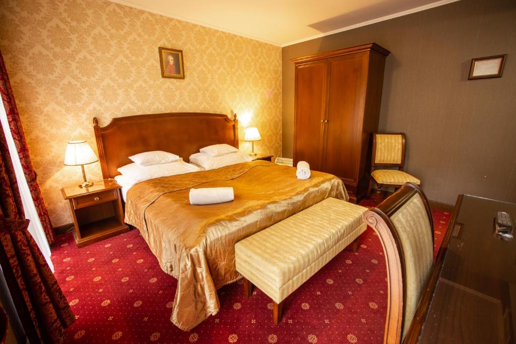 Postel nebo postele na pokoji v ubytování Mozart Hotel