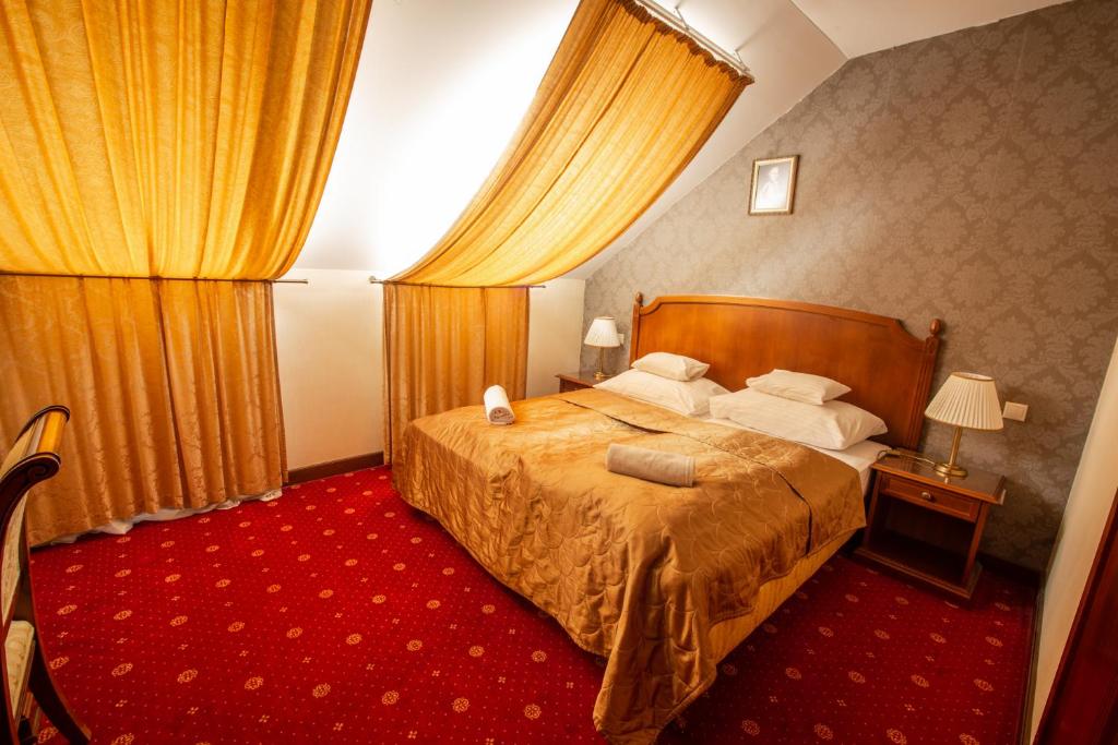 Postel nebo postele na pokoji v ubytování Mozart Hotel