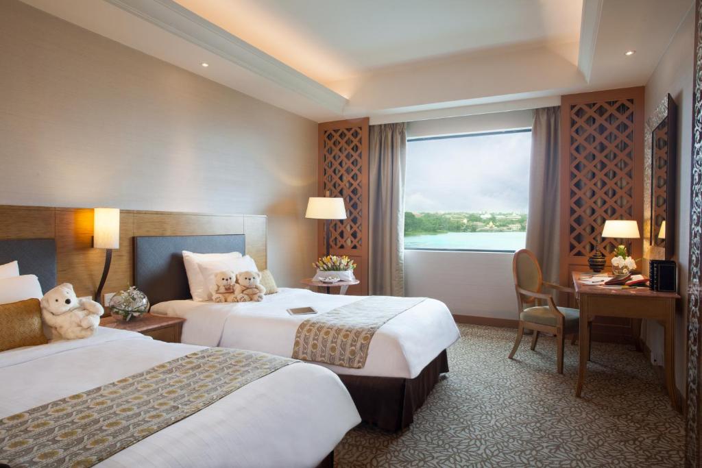 Ένα ή περισσότερα κρεβάτια σε δωμάτιο στο Sedona Hotel Yangon