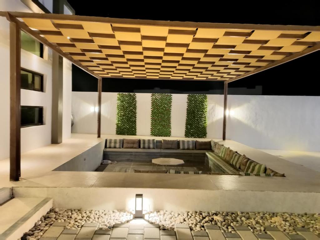 Posezení v ubytování Al nayrouz chalet استراحة النيروز