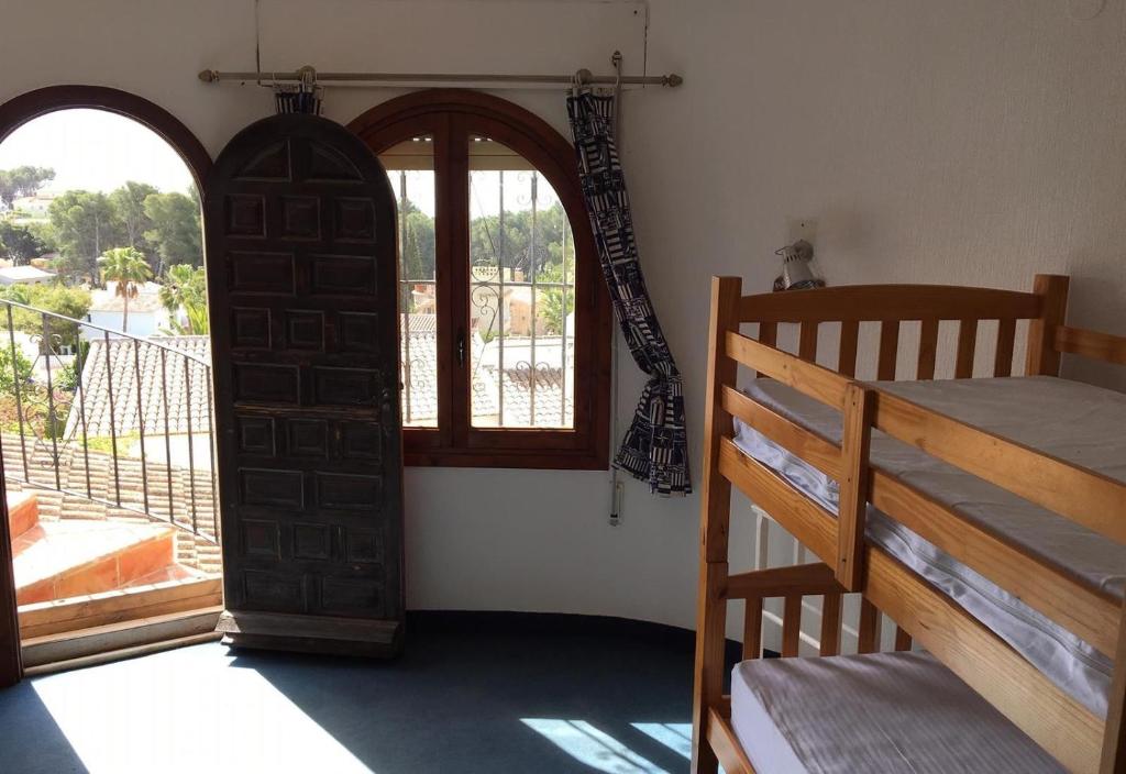 A bed or beds in a room at Casa Pera