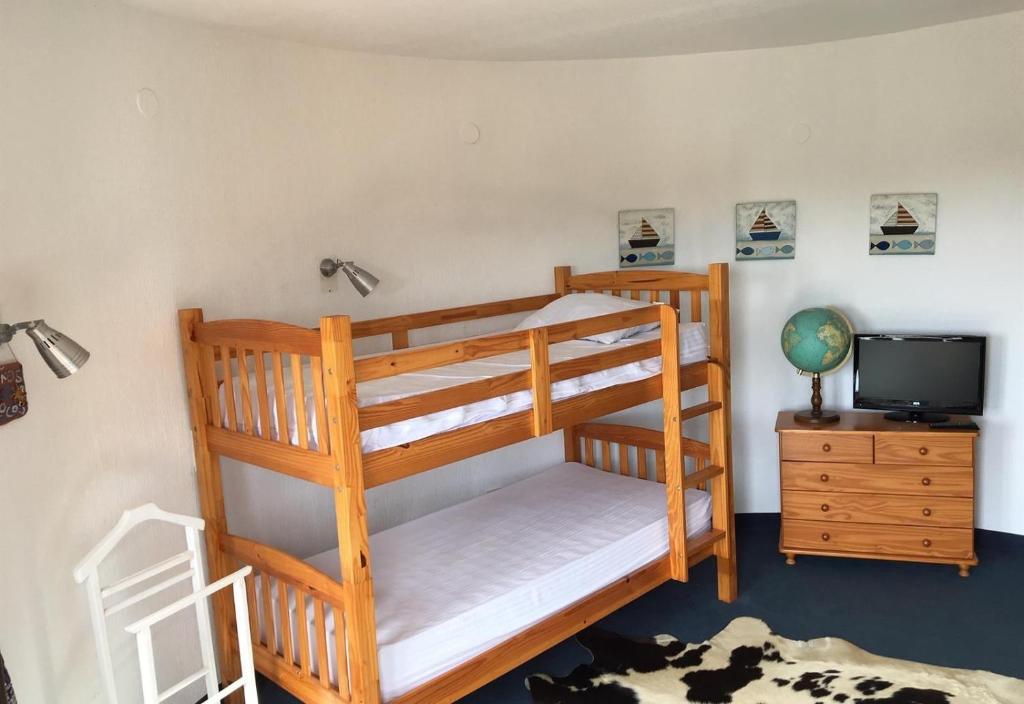 A bed or beds in a room at Casa Pera