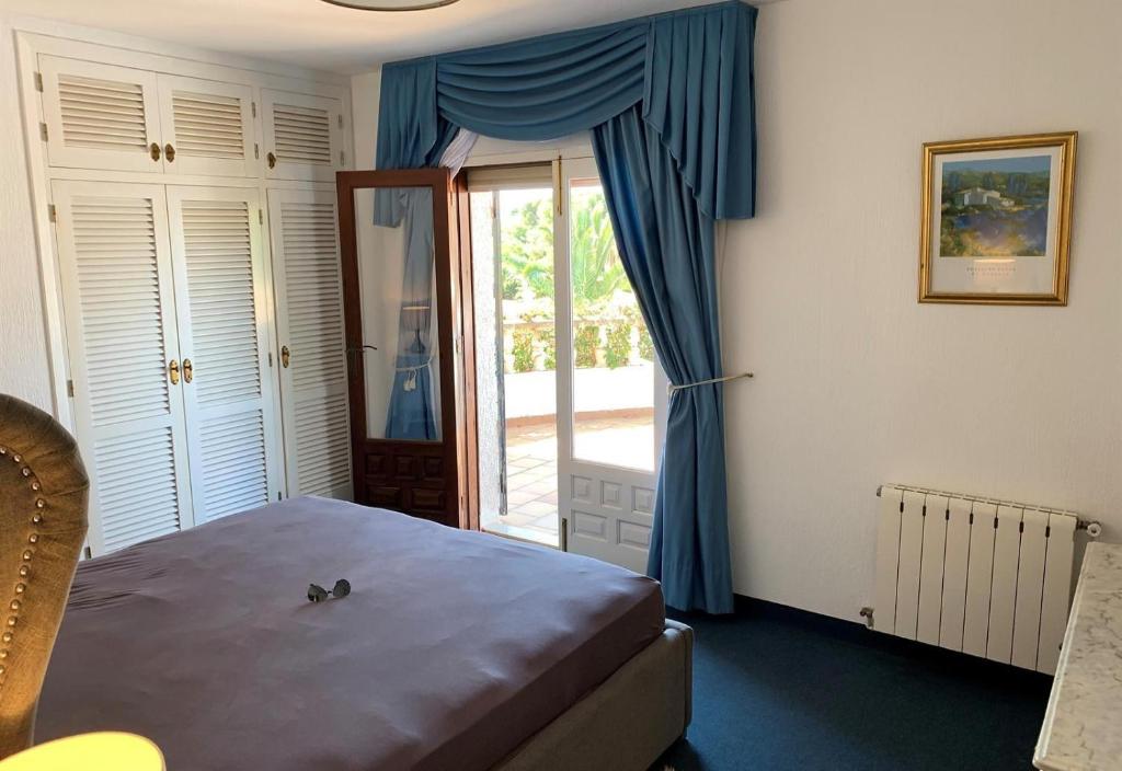 A bed or beds in a room at Casa Pera
