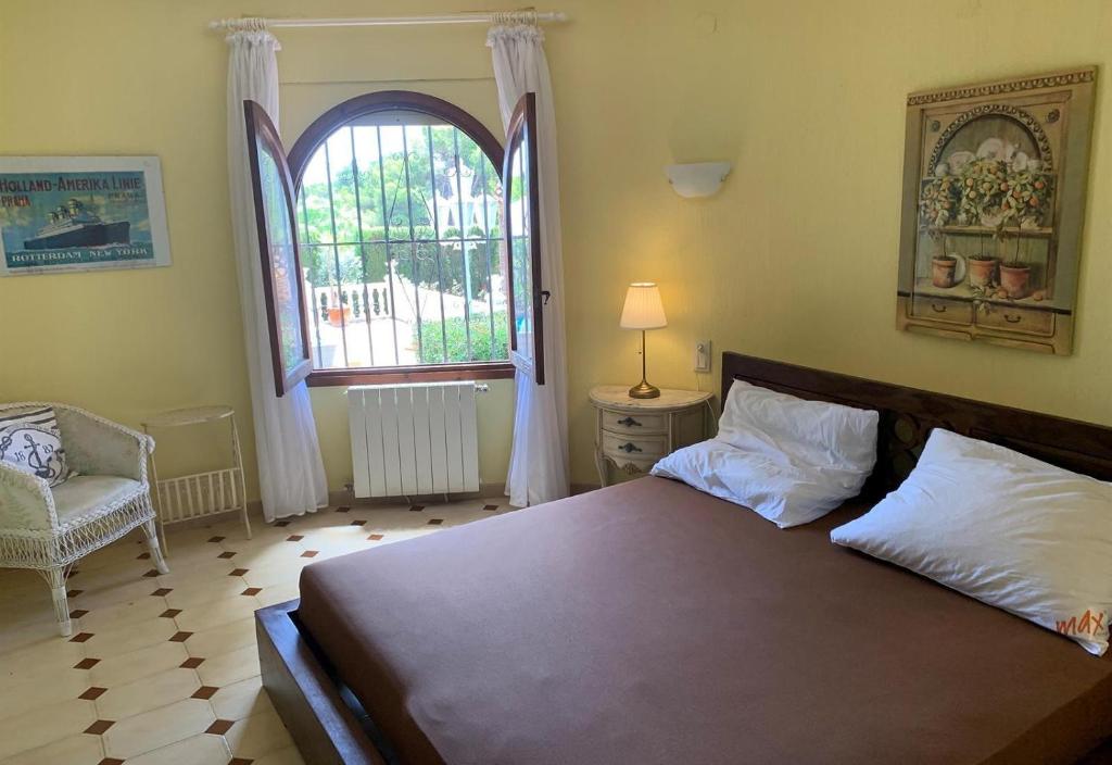 A bed or beds in a room at Casa Pera
