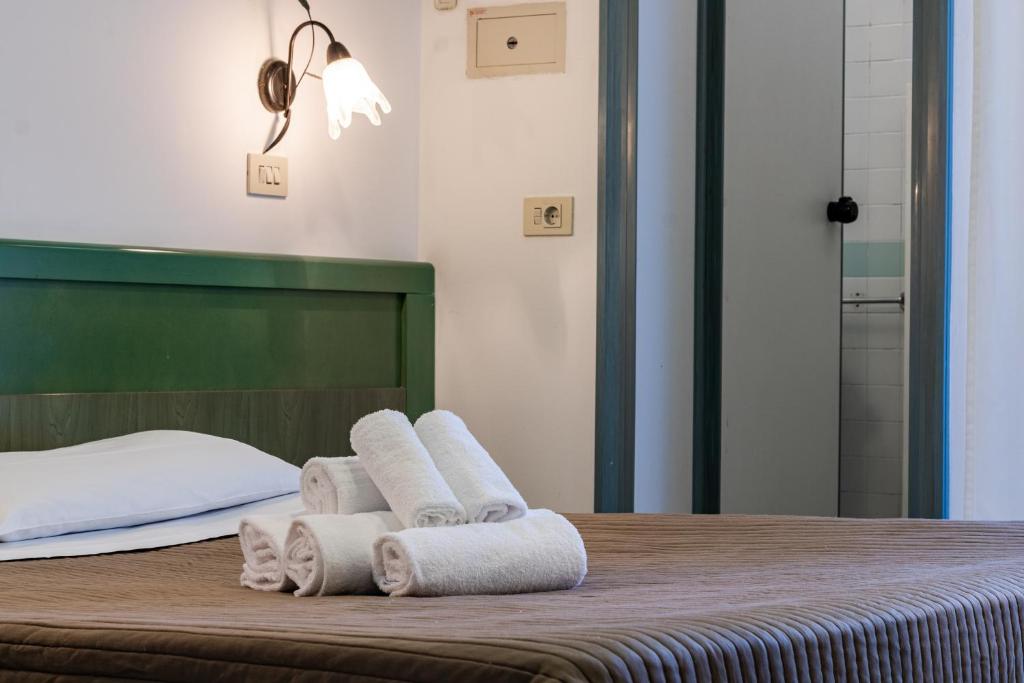 Postel nebo postele na pokoji v ubytování Esedra Hotel