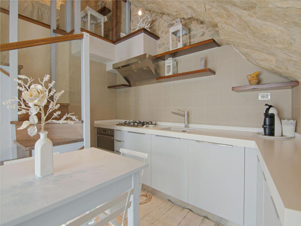 A kitchen or kitchenette at Apartment in Petrella Guidi with Medieval Charm