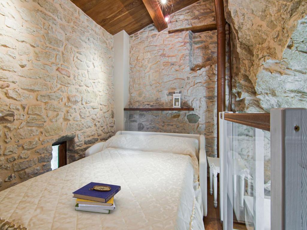 A bed or beds in a room at Apartment in Petrella Guidi with Medieval Charm