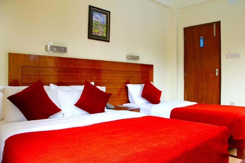 Ein Bett oder Betten in einem Zimmer der Unterkunft Hotel Tara