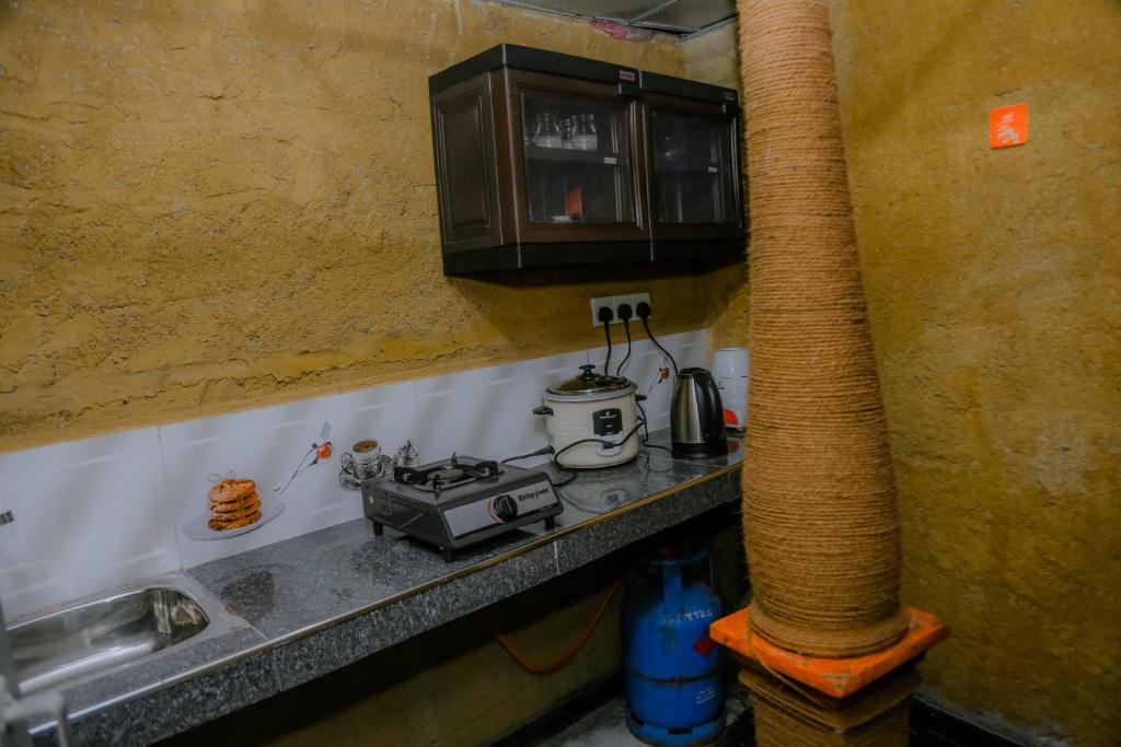 Kuchyň nebo kuchyňský kout v ubytování Ruwan Jungle Homestay