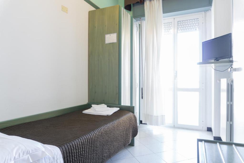 Postel nebo postele na pokoji v ubytování Esedra Hotel