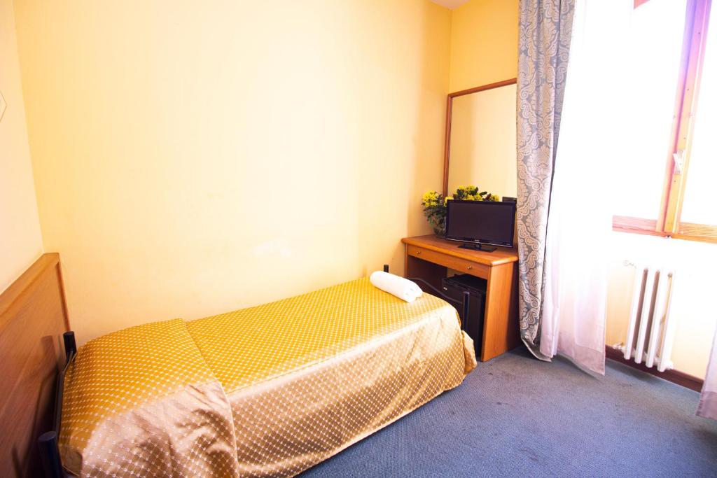 A bed or beds in a room at Hotel PRime - Montecatini