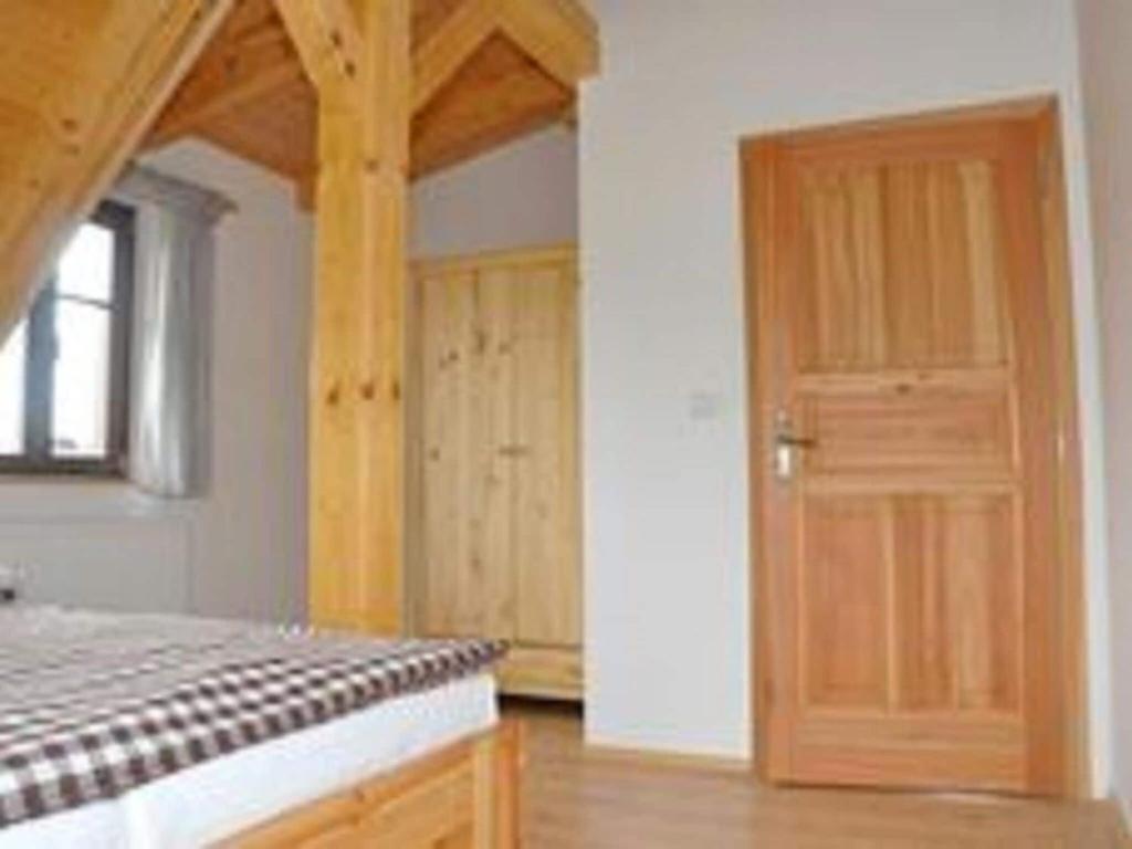 Postel nebo postele na pokoji v ubytování Spacious Holiday Home in Dlouhý with Sauna