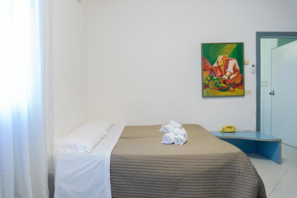 Postel nebo postele na pokoji v ubytování Esedra Hotel