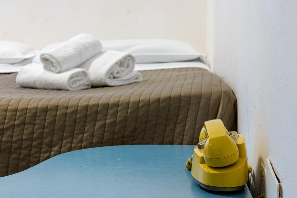 Postel nebo postele na pokoji v ubytování Esedra Hotel