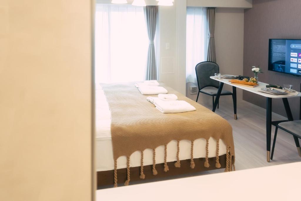 TV a/nebo společenská místnost v ubytování 谷町君 HOTEL 日本橋47