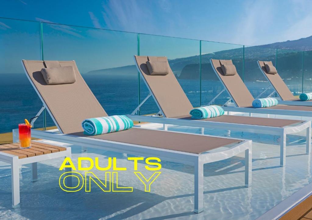 a group of chairs and tables on a cruise ship at Hotel Atlantic Mirage Suites & SPA - ADULTS ONLY in Puerto de la Cruz