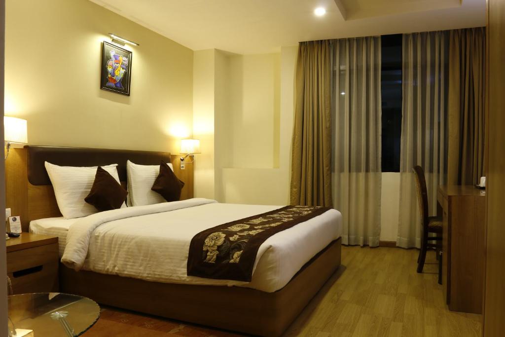Postel nebo postele na pokoji v ubytování Hotel Mirage Regency