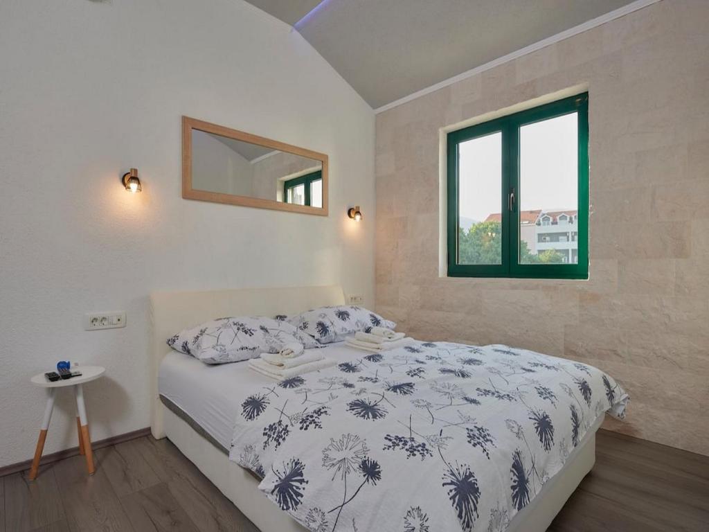 Postel nebo postele na pokoji v ubytování Apartments Vujina