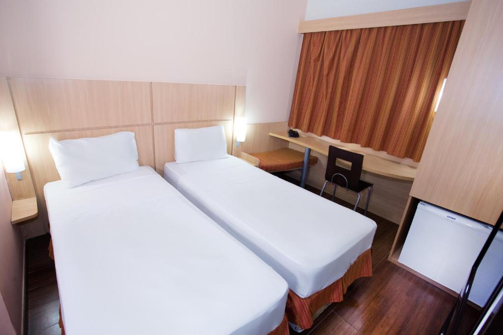 Postel nebo postele na pokoji v ubytování ibis Feira de Santana