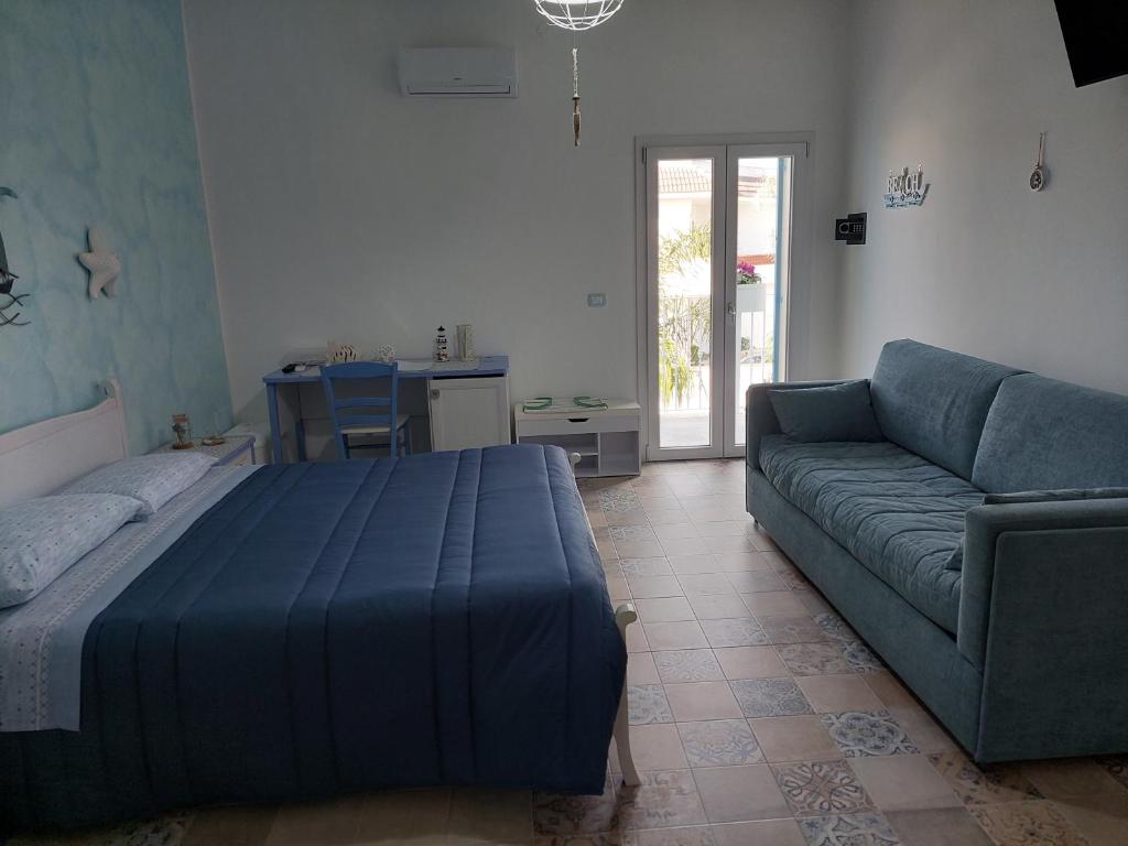 A bed or beds in a room at B&B LA COLIMENA
