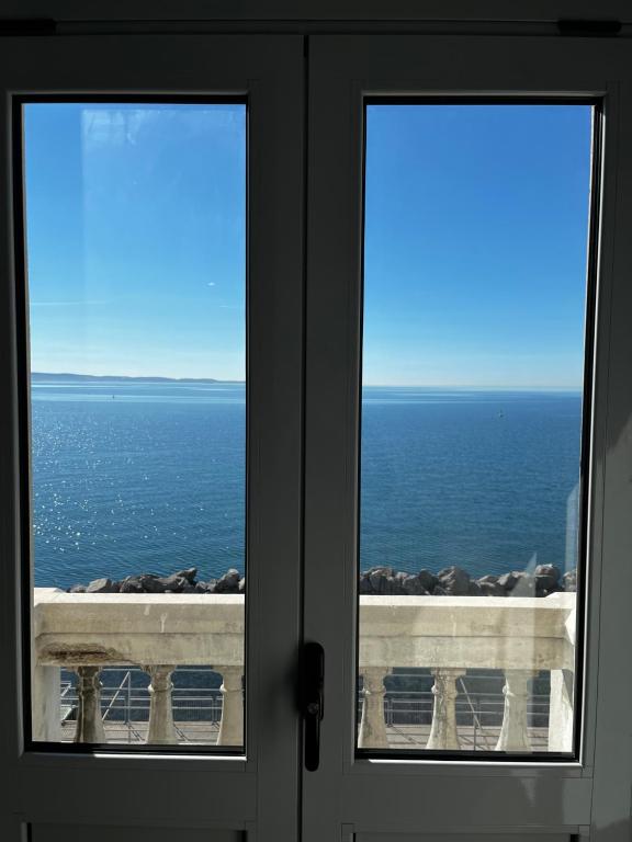 a view of the ocean from a window at Villa Tergeste in Trieste