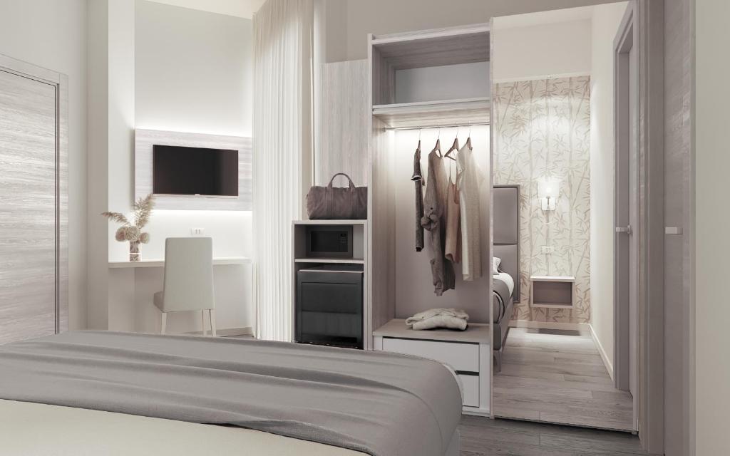 A bed or beds in a room at Hotel Fabius