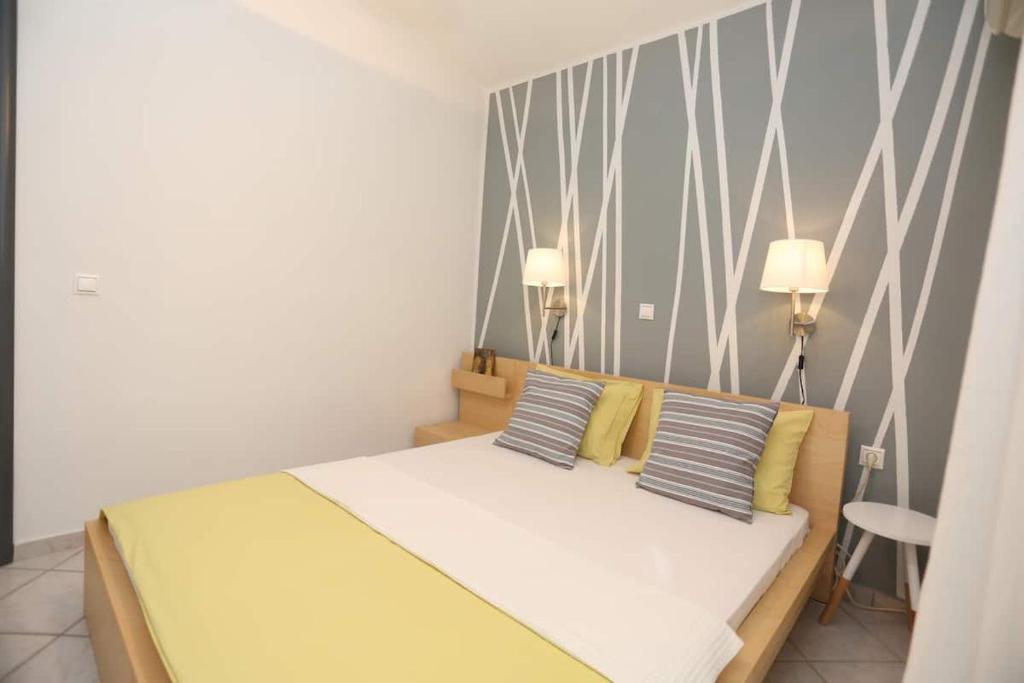 Postel nebo postele na pokoji v ubytování Villa Asterios