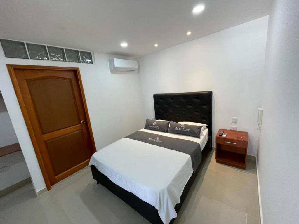 Postel nebo postele na pokoji v ubytování Hotel Aeromar Central