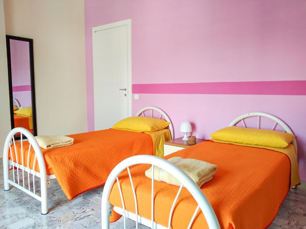 Postel nebo postele na pokoji v ubytování Casa Bignardi - Affitti Brevi Italia