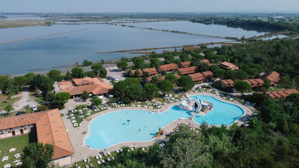 an aerial view of a resort with a large swimming pool at Villaggio Ca' Laguna in Grado