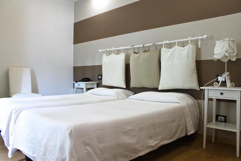 Postel nebo postele na pokoji v ubytování Albergo Al Castello