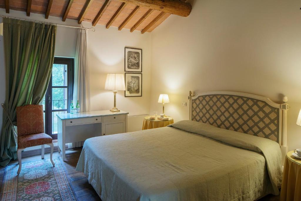 Postel nebo postele na pokoji v ubytování Hotel Villa Giona