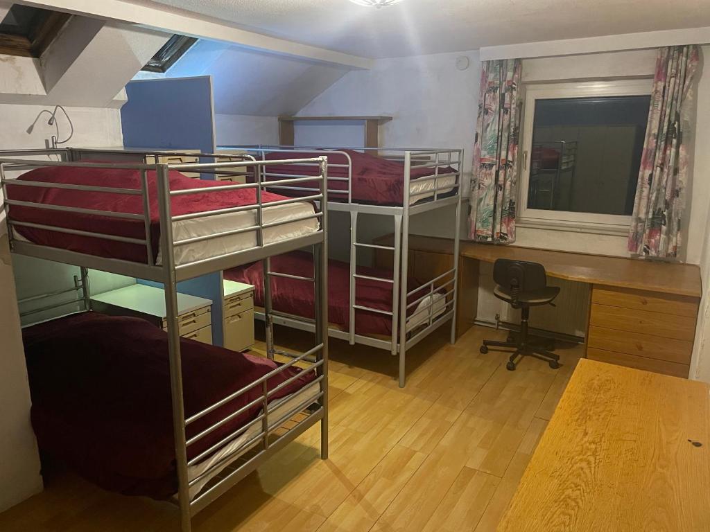 Postel nebo postele na pokoji v ubytování Suburb Hostel