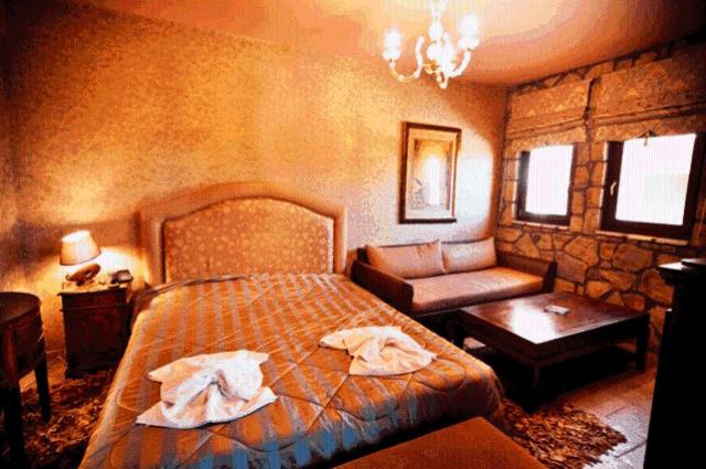 Ένα ή περισσότερα κρεβάτια σε δωμάτιο στο Silva Suites