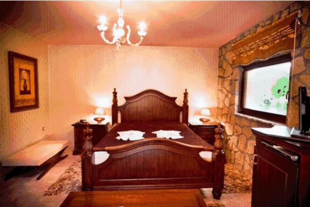 Ένα ή περισσότερα κρεβάτια σε δωμάτιο στο Silva Suites