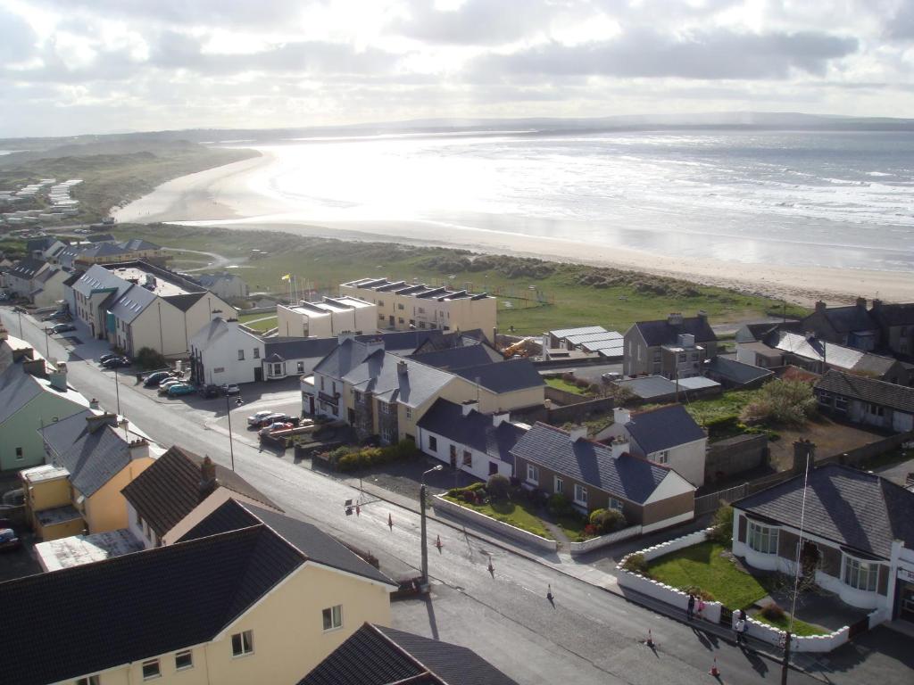 an aerial view of a small town next to the beach at Sun Apartments in Enniscrone
