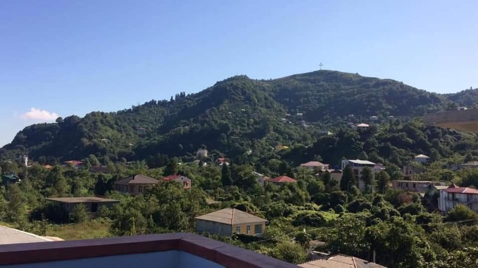 a view of a mountain from a house at Hotel Rio Gonio in Gonio