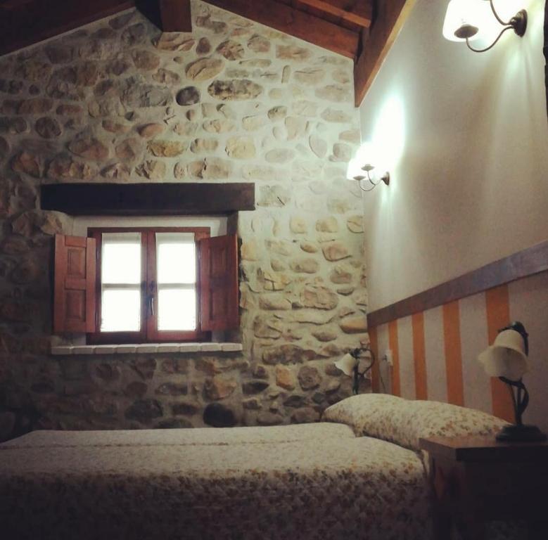 Postel nebo postele na pokoji v ubytování La Posada de Maria