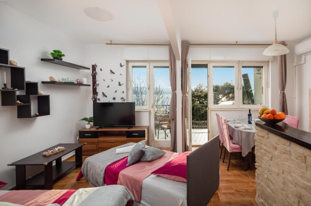 TV a/nebo společenská místnost v ubytování Beach Apartment Milena