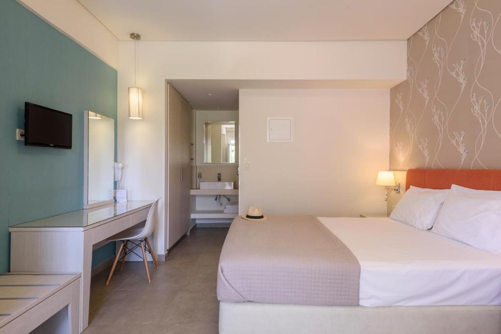 Postel nebo postele na pokoji v ubytování Poseidon Studios & Apartments