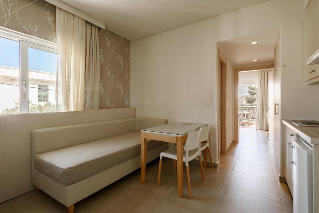 Postel nebo postele na pokoji v ubytování Poseidon Studios & Apartments