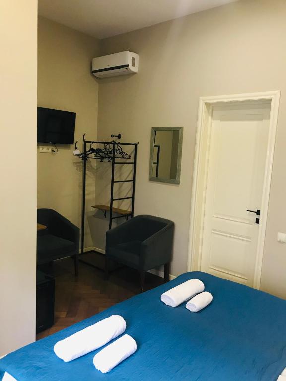Postel nebo postele na pokoji v ubytování Hotel Loft