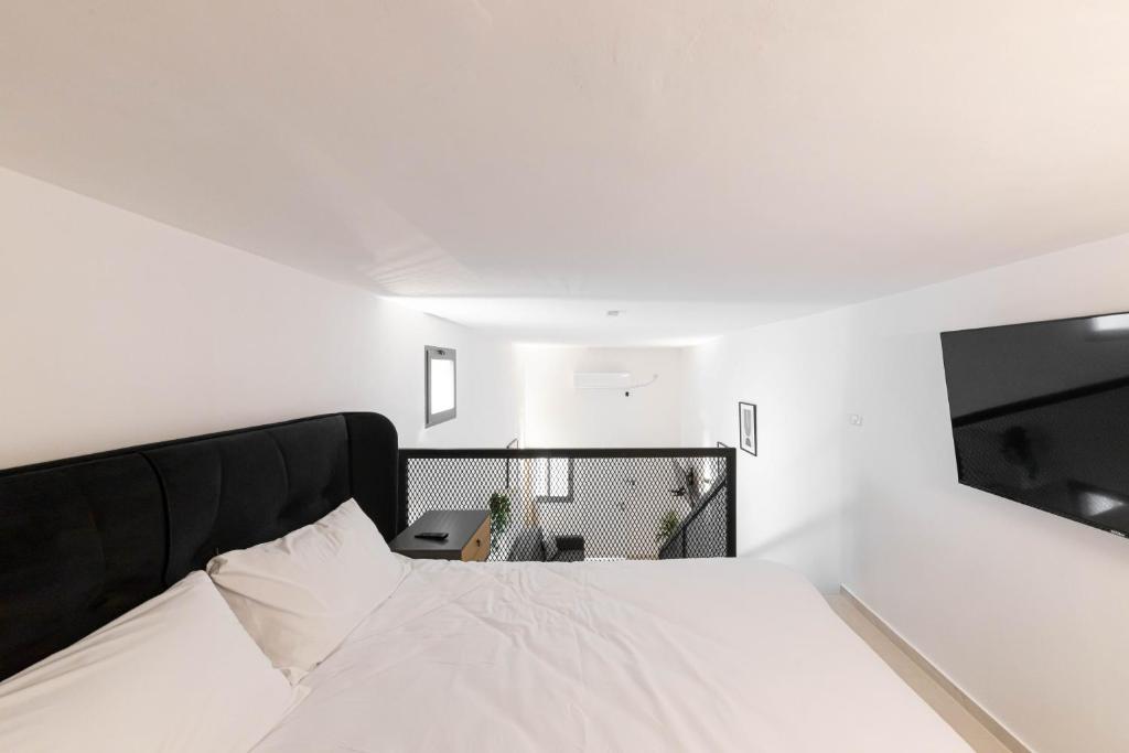 Postel nebo postele na pokoji v ubytování Cohens apartments