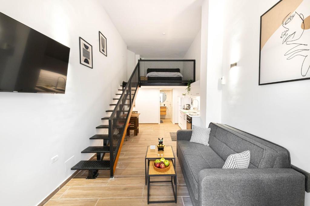 a living room with a couch and a table at Cohens apartments in Jerusalem